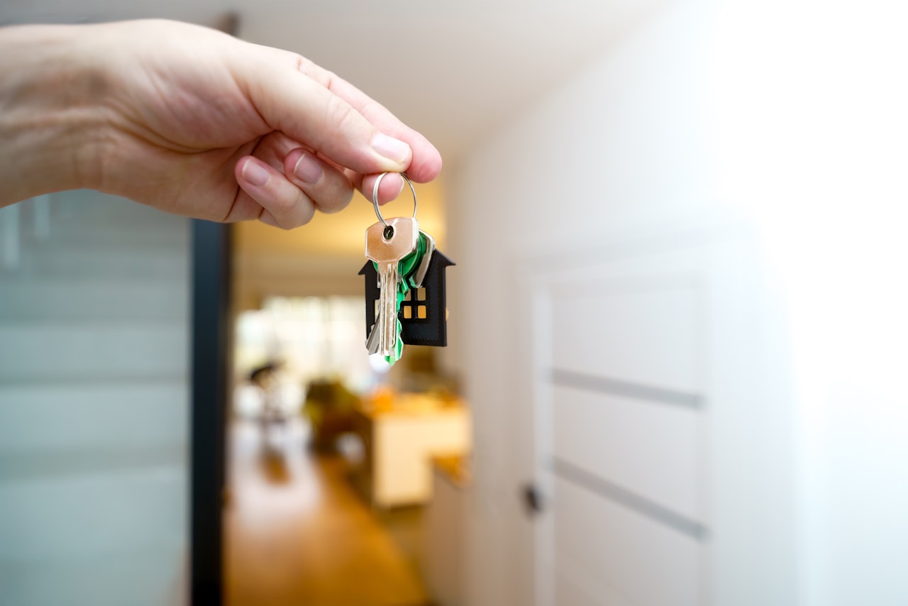 Handing over house keys at the front door